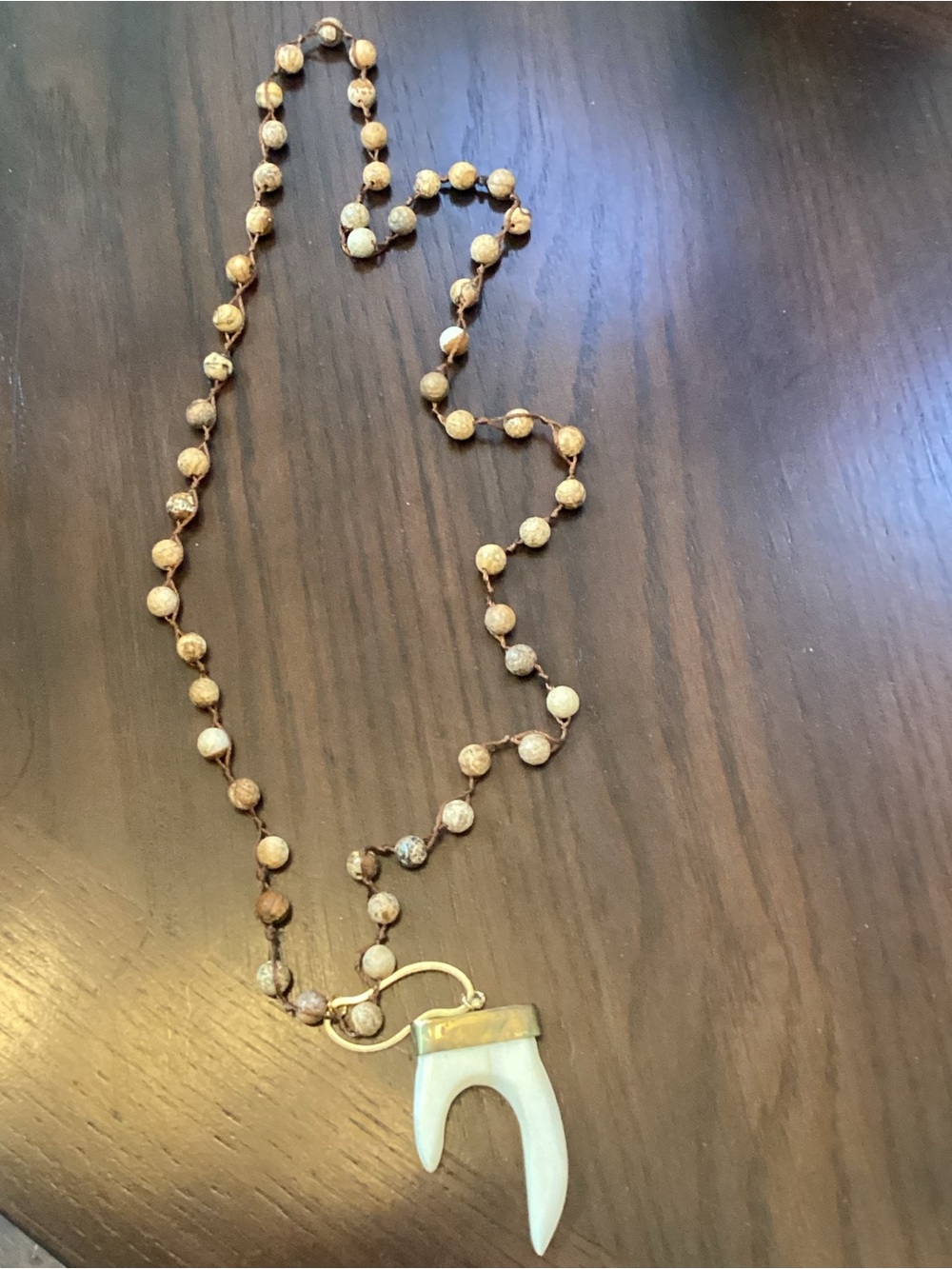 Beaded Necklace with White Horn Pendant and Gold Accents
